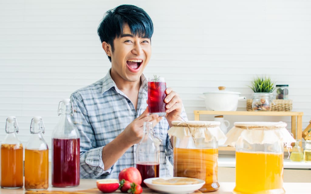 Portrait of man with homemade kombucha